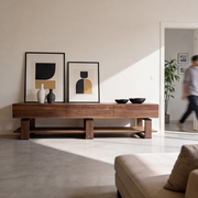 Bodhi American walnut TV unit with drawers and shelf in a modern living room

