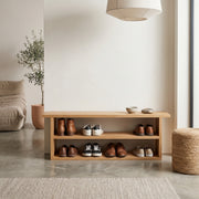 Solid oak shoe rack in a hallway with open shoe storage

